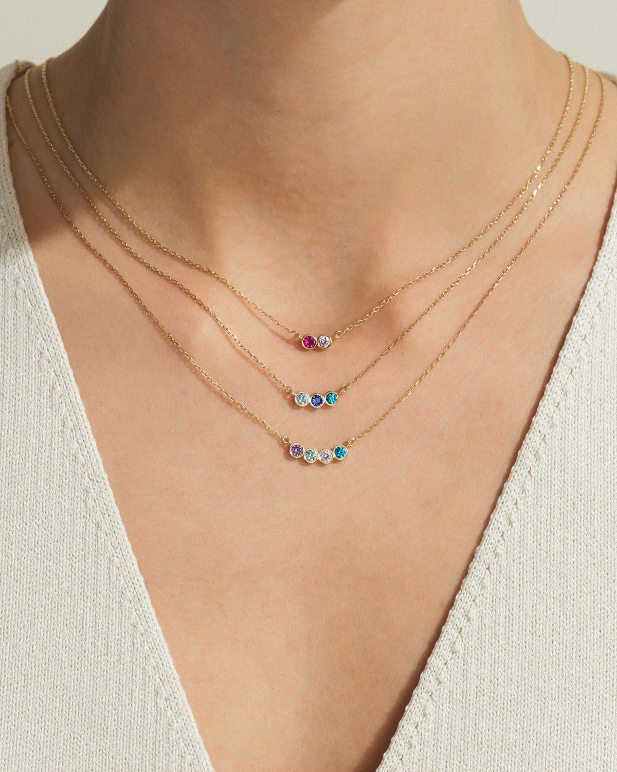Personalized necklace with different birthstone counts